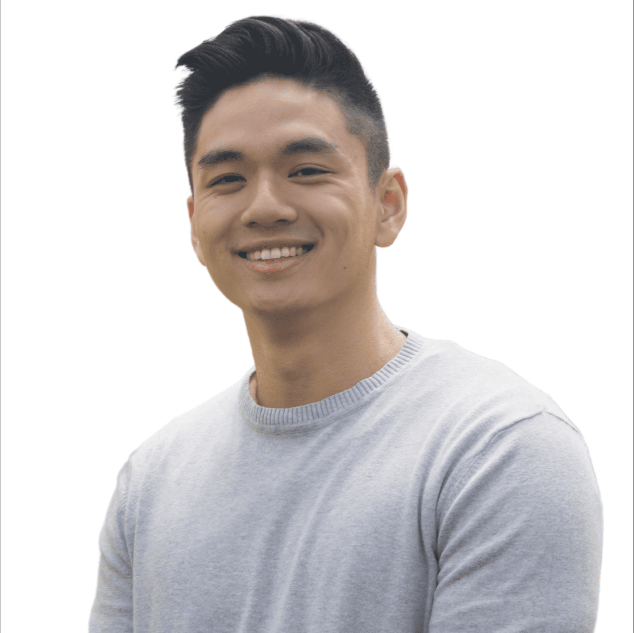 A young Asian man, Alan Vu, smiling and wearing a light gray sweater with a stylish haircut, against a white background.