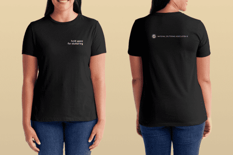 A woman modeling a Hold Space Tee, viewed from both front and back. the front reads "hold space for subtitling" and the back has a logo with the text "worldwide subtitling association.