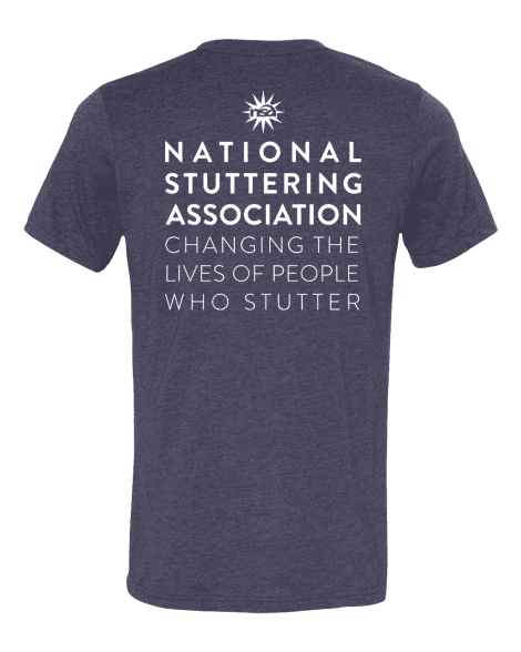 A #WeStutter Adult Tee displayed against a green background, featuring white text on the back that reads "national stuttering association - changing the lives of people who stutter" with a white star logo.