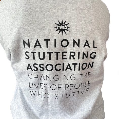 Grey hoodie with black font that says 'National Stuttering Association Changing The Lives Of People Who Stutter' on the back